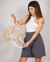 Semi-transparent cream handbag