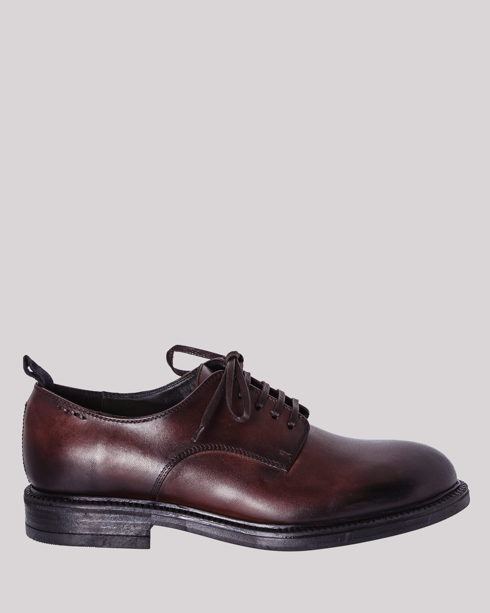 Dark brown laced shoe