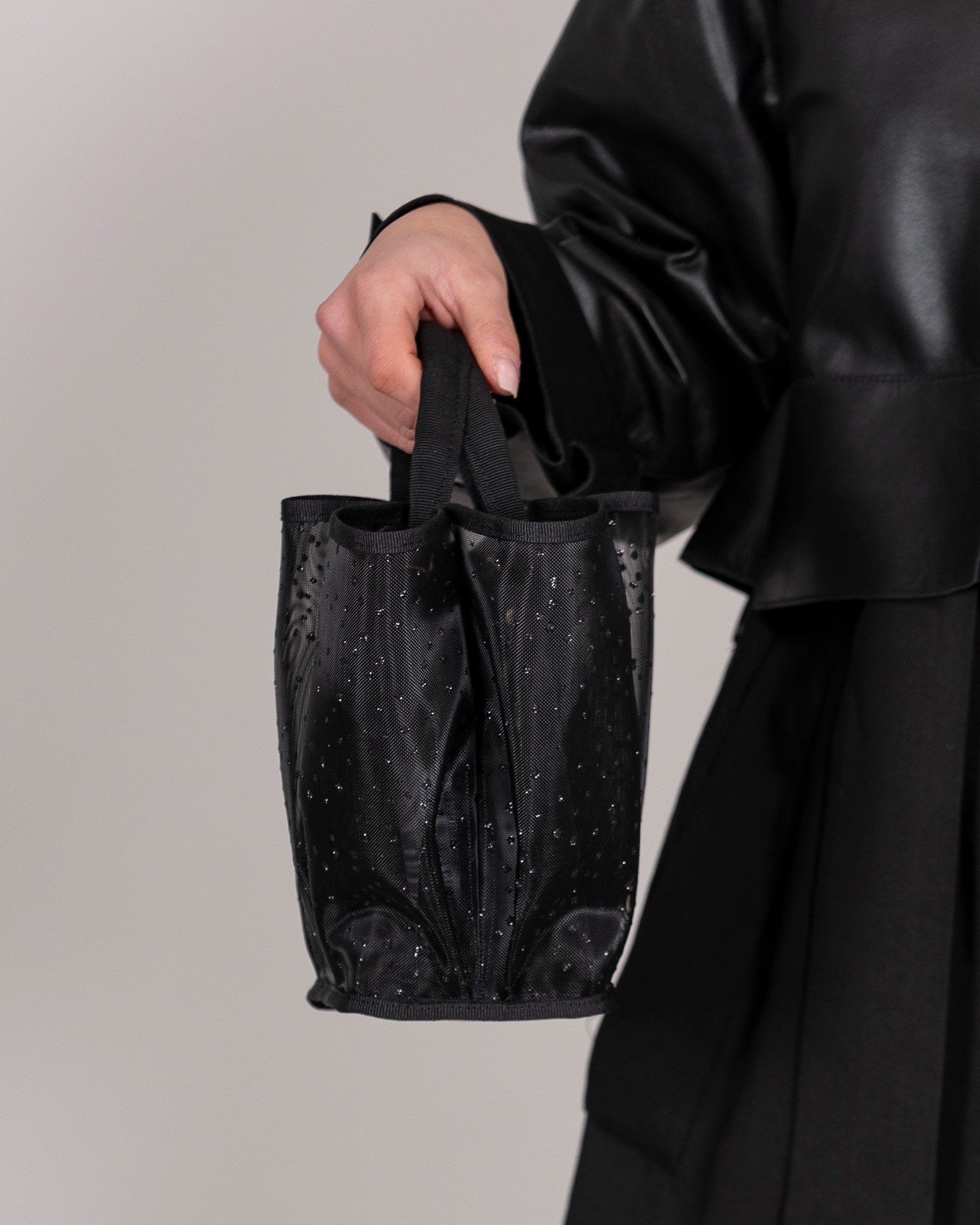 Black semi-transparent handbag